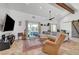 Cozy living room with tiled floors, modern ceiling fan, and natural light at 2213 W Oakey Blvd, Las Vegas, NV 89102