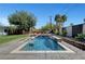 Backyard pool features a modern design with a cascading waterfall feature at 2213 W Oakey Blvd, Las Vegas, NV 89102