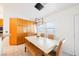 Kitchen dining area with light wood cabinets and a large table at 2424 Ping Dr, Henderson, NV 89074