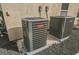 Two Goodman brand central AC units are installed in the backyard at 2424 Ping Dr, Henderson, NV 89074