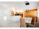 Open concept kitchen and dining area with modern light fixture at 2424 Ping Dr, Henderson, NV 89074