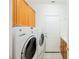 Laundry room with washer, dryer, and cabinets at 2424 Ping Dr, Henderson, NV 89074