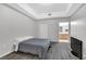 Simple bedroom with gray bedding and wood-like flooring at 31 E Agate Ave # 205, Las Vegas, NV 89123