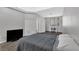 Spacious bedroom with gray bedding and a home office area at 31 E Agate Ave # 205, Las Vegas, NV 89123