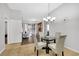 Dining area with glass table and four chairs, open to living room at 31 E Agate Ave # 205, Las Vegas, NV 89123