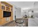 Living room, featuring wood shelving and a dining area at 31 E Agate Ave # 205, Las Vegas, NV 89123