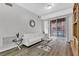 Living room with white couch and glass coffee table at 31 E Agate Ave # 205, Las Vegas, NV 89123