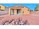 A large backyard featuring a brick paved surface and covered patio at 3665 Bella Legato Ave, North Las Vegas, NV 89081