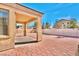 Backyard patio with covered area and brick paved surface at 3665 Bella Legato Ave, North Las Vegas, NV 89081