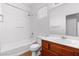 Bright bathroom featuring a shower-tub combo, single sink vanity, and wood-look floors at 3665 Bella Legato Ave, North Las Vegas, NV 89081