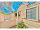 Charming single-story home featuring stucco walls, a gated front courtyard, and desert landscaping at 3665 Bella Legato Ave, North Las Vegas, NV 89081