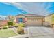 Charming single-story home with a well-manicured lawn and two-car garage at 3665 Bella Legato Ave, North Las Vegas, NV 89081