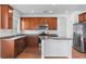 An inviting kitchen with stainless steel appliances and central island for meal preparation at 3665 Bella Legato Ave, North Las Vegas, NV 89081