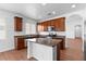 Modern kitchen with center island, ample counter space, and lots of natural light from a bright window at 3665 Bella Legato Ave, North Las Vegas, NV 89081