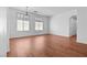 Bright living room with hardwood floors, high ceilings, and lots of natural light streaming through the windows at 3665 Bella Legato Ave, North Las Vegas, NV 89081