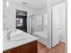 This bathroom features double sinks, shower, bathtub, and tile flooring at 3665 Bella Legato Ave, North Las Vegas, NV 89081