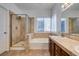 Bathroom with shower, bathtub, and double vanity at 1303 Royal Creek Ct, North Las Vegas, NV 89031