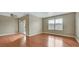 Spacious living room with hardwood floors and sliding glass door at 2300 E Silverado Ranch Blvd # 1094, Las Vegas, NV 89183
