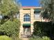 Two-story house with a fountain, ornate gate, and manicured landscaping at 5740 N Park St, Las Vegas, NV 89149