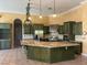 Gourmet kitchen featuring granite countertops and dark green cabinetry at 5740 N Park St, Las Vegas, NV 89149