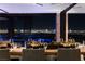 Open dining area featuring city views, modern furnishings, and stylish place settings for elegant dining at 685 Dragon Peak Dr, Henderson, NV 89012