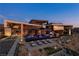 Striking contemporary home with a large pool, poolside seating, and meticulously landscaped grounds at 685 Dragon Peak Dr, Henderson, NV 89012
