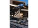 Modern home with striking outdoor architectural details, water feature, and desert-style landscaping at 685 Dragon Peak Dr, Henderson, NV 89012