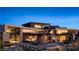 Luxury modern home with a sprawling backyard, a large pool, and outdoor living spaces at 685 Dragon Peak Dr, Henderson, NV 89012