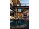 A unique pool with floating platforms and modern architecture in the background, creating a luxurious escape at 685 Dragon Peak Dr, Henderson, NV 89012