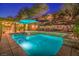 Tranquil outdoor oasis featuring a large pool, relaxing spa, and meticulously landscaped surroundings at 48 Panorama Crest Ave, Las Vegas, NV 89135