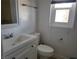 Cozy bathroom featuring white vanity and a window at 1828 Hassett Ave, Las Vegas, NV 89104