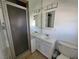 Bathroom featuring shower stall, mirrored shelving, and a vanity at 1828 Hassett Ave, Las Vegas, NV 89104