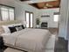 Staged bedroom featuring hardwood floors and a fireplace at 1828 Hassett Ave, Las Vegas, NV 89104
