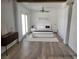 Staged bedroom offers ample space, natural light, and hardwood floors at 1828 Hassett Ave, Las Vegas, NV 89104