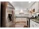 Functional kitchen with white cabinets, granite countertops, and stainless steel appliances at 1828 Hassett Ave, Las Vegas, NV 89104