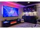 Home theater with large screen, fireplace, and bar area at 8620 Grove Mill Ct, Las Vegas, NV 89139