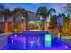 Stunning pool with a waterfall feature and landscape lighting at 8620 Grove Mill Ct, Las Vegas, NV 89139