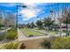 Outdoor bocce ball court in a recreation area with landscaping and lighting for daytime or nighttime play at 7457 Widewing Dr, North Las Vegas, NV 89084