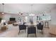 Open concept living space with dining area, bar seating, and seamless flow to the kitchen at 7457 Widewing Dr, North Las Vegas, NV 89084