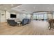 Spacious lobby with multiple seating areas, large windows, and stylish decor creating a welcoming atmosphere at 7457 Widewing Dr, North Las Vegas, NV 89084