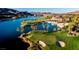 Aerial view of a golf course and lake in a vibrant community at 45 Moltrasio Ln, Henderson, NV 89011