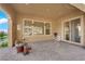 Covered patio featuring tile flooring and a ceiling fan with glass sliding door at 45 Moltrasio Ln, Henderson, NV 89011
