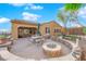 Scenic backyard with a built-in fire pit, patio, and a well-maintained putting green at 45 Moltrasio Ln, Henderson, NV 89011