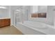 Spa-like bathroom boasts soaking tub, large window, and walk-in shower at 45 Moltrasio Ln, Henderson, NV 89011
