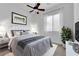 Cozy bedroom features ceiling fan, neutral decor, and natural light at 45 Moltrasio Ln, Henderson, NV 89011