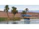 Scenic boat tour on the lake, surrounded by palm trees and desert landscape at 45 Moltrasio Ln, Henderson, NV 89011