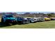 Collection of classic cars showcased at a community event on manicured landscaping at 45 Moltrasio Ln, Henderson, NV 89011