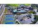 Aerial view showcasing the community amenities: pools, tennis courts, and manicured landscaping at 45 Moltrasio Ln, Henderson, NV 89011