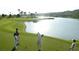 Scenic golf course alongside a serene lake, perfect for golf enthusiasts in this community at 45 Moltrasio Ln, Henderson, NV 89011