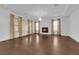 Spacious living room featuring hardwood floors and a fireplace at 45 Moltrasio Ln, Henderson, NV 89011